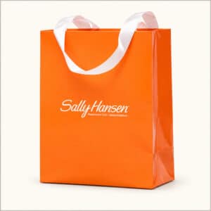 Pomarańczowa torba prezentowa premium Sally Hansen z białą wstążką